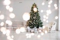 Classic christmas New Year decorated interior room New year tree. Christmas tree with gold decorations. Modern white classical sty Royalty Free Stock Photo