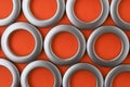 Classic chrome eyelets for curtains on an orange background