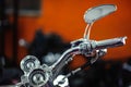 Classic chrome . Motorcycle handle. The gas lever on the chopper. Speed dialing. Details of the motorcycle close-up. Motorcycle