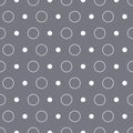 Classic circles and dots seamless repeat pattern. Hand-drawn dots and circles in different sizes on a dusty blue