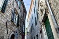 Classic city alleyway with old-fashioned buildings, in Kotor, Montenegro. Royalty Free Stock Photo