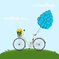Classic city bicycle, ecological sport transport. Beige women bicycle with metal basket, yellow tulips and balloons attached to tr Royalty Free Stock Photo