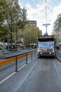 Classic city tram stopped at station along Swanston Streetd