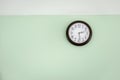 Classic clock on empty wall, Vintage tone Royalty Free Stock Photo