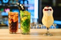 Classic cold cocktails - rum and cola, mojito and pina colada