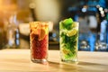 Classic cold cocktails - rum and cola and mojito