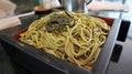 Classic cold Japanese noodles on wooden tray