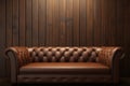 Classic comfort Brown leather couch enhances room with wooden wall