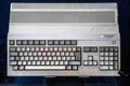 Warsaw, Poland - March 19, 2024. Commodore Amiga A-500 Computer on Blue Royalty Free Stock Photo