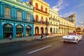 Classic convertible car and old colorful buildings in downtown Havana Royalty Free Stock Photo