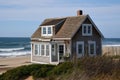 classic cottage with beachy exterior, waves crashing in the background