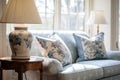 Classic cottage living room with blue-toned vintage patterns decor and natural light. Royalty Free Stock Photo