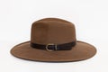 Classic cowboy brown felt hat with strap and copper closure on white background Royalty Free Stock Photo