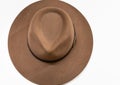 Classic cowboy brown felt hat with strap and copper closure on white background Royalty Free Stock Photo