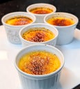 Classic CrÃÂ¨me BrÃÂ»lÃÂ©e in White Ramekins Royalty Free Stock Photo