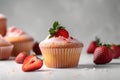 classic cupcake with fresh and juicy strawberry filling on white background