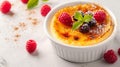 A classic creme brulee dessert, finished with a few fresh berries for a touch of freshness and visual appeal