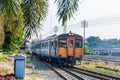 Classic diesel trains transport passengers and tourists in Thailand