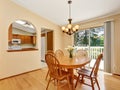 Classic dining area with wooden table set and hardwood floor Royalty Free Stock Photo