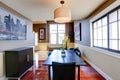 Classic dining room with ivory and brown wall trim