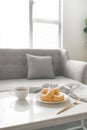 Classic donut. Morning breakfast on table in living room at home