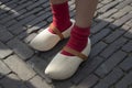 Classic Dutch wooden shoes worn with red socks
