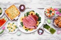 Classic Easter ham dinner. Top down view table scene on a white wood background. Royalty Free Stock Photo