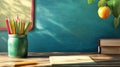 School Background with Chalkboard, Notebook, Pencils, and Apple Branch Educational Theme Royalty Free Stock Photo