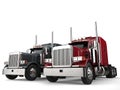 Classic eighteen wheeler trucks in metallic gray and red colors