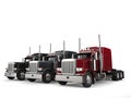 Classic eighteen wheeler trucks in red, black and gray colors