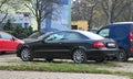 Classic elegant old black veteran coupe car Mercedes Benz CLK 220 left side view parked