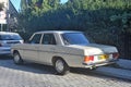 Classic elegant old ebony white grey sedan car Mercedes Benz 240D left side rear view parked