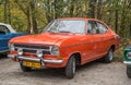 Classic elegant orange German car Opel Kadett parked