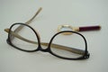 Classic eyeglasses with magnifying glass behind