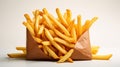 A classic fast food golden crispy fries served in a brown paper wrap isolated on white