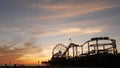 Classic ferris wheel, amusement park on pier in Santa Monica pacific ocean beach resort. Summertime California aesthetic, iconic