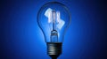 Classic Filament Bulb: A Symbol of Innovation and Illumination on a Blue Canvas Royalty Free Stock Photo