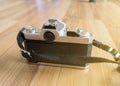 A film camera showing back panel and View Finder with wooden floor background Royalty Free Stock Photo