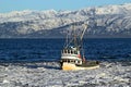 Classic fishing boat in an icy bay