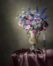 Still life with luxurious bouquet of multicolored flowers