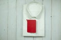 Classic folded white men`s shirt with empty red tag Royalty Free Stock Photo