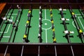 Classic foosball of playing field with rows of players