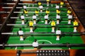 Classic foosball of playing field with rows of players