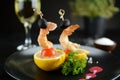 Grilled shrimps served on a toothpick with black olive and cherry tomato. Royalty Free Stock Photo