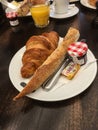 Classic French breakfast with bread and croissant and jam