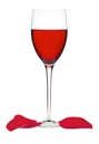 Classic Glass of Red Wine and rose petals isolated on a white