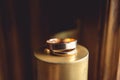 Classic gold wedding rings on the top of golden cone Royalty Free Stock Photo