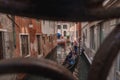 Classic Gondola Gliding Through Iconic Venetian Canal with Traditional Architecture Royalty Free Stock Photo