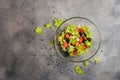 Classic greek salad in a glass deep plate. Top view. Copy space for text.