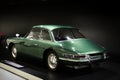 Classic green car on display at the Porsche museum